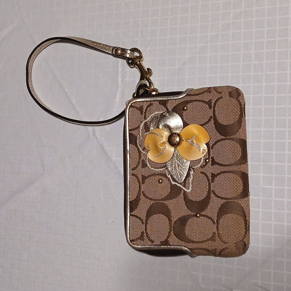 Coach Elegant Brown Wristlet with Floral Accent
